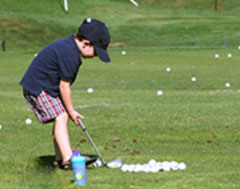 Boy playing golf
